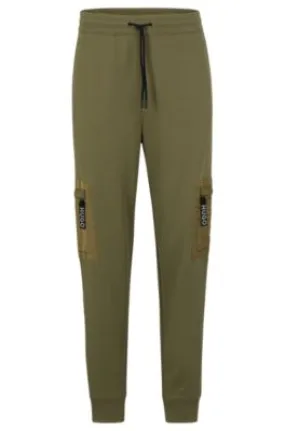 Relaxed-fit tracksuit bottoms with cargo pockets